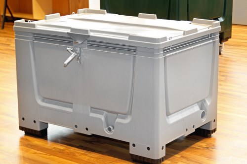 Staff reviewing service records for a commercial rubbish collection complaint